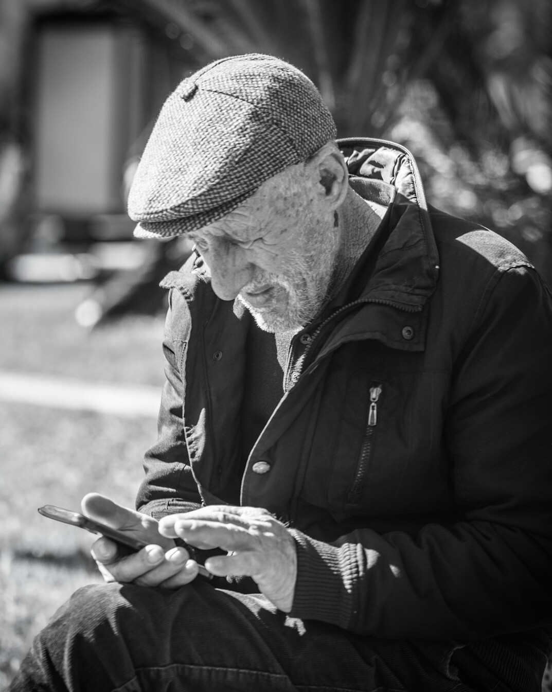 elderly person using tablet